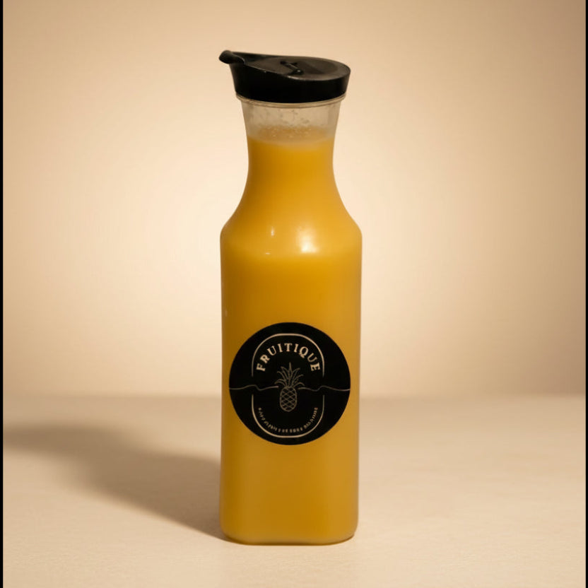 Yellow bottle with black cap and label on a white background