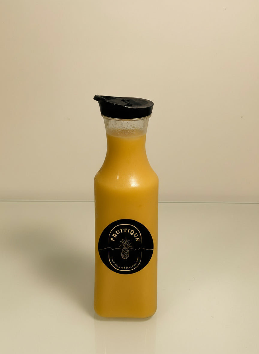Yellow bottle with black cap and label on a white background