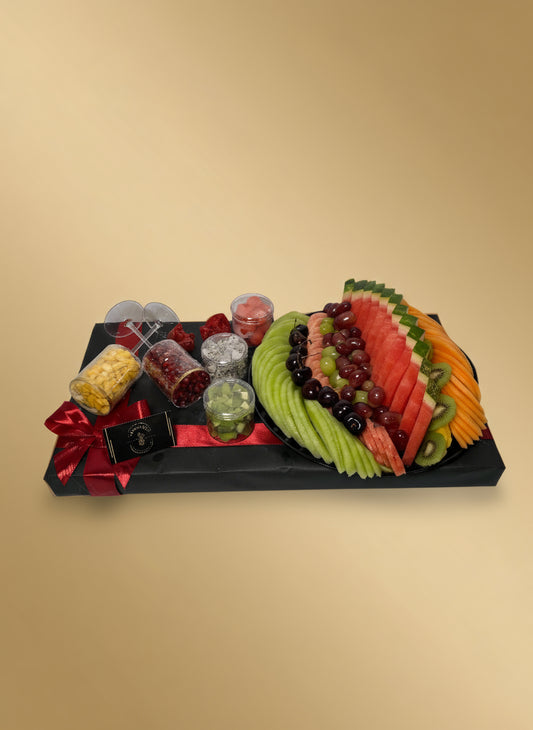 Fruit and dessert platter on a white background