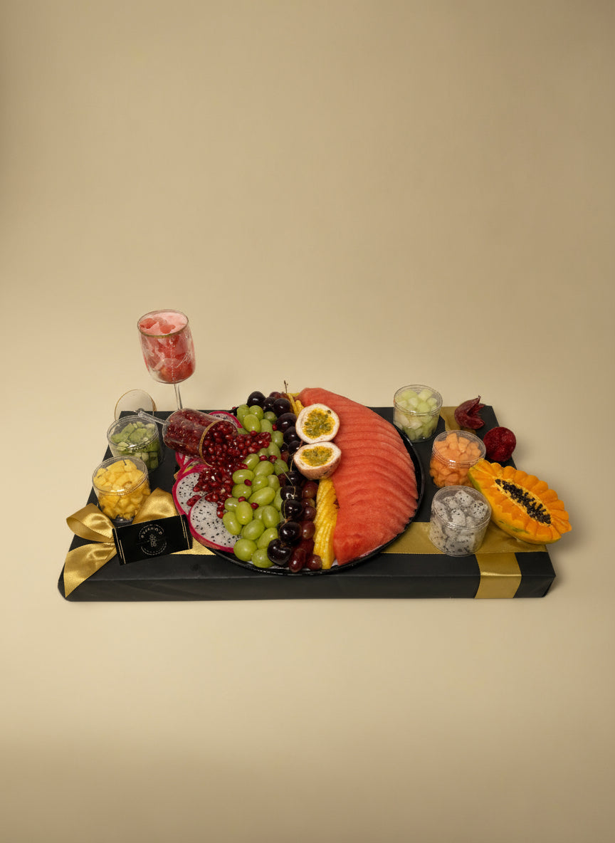 Decorative wall art resembling a fruit platter with a black frame on a white background